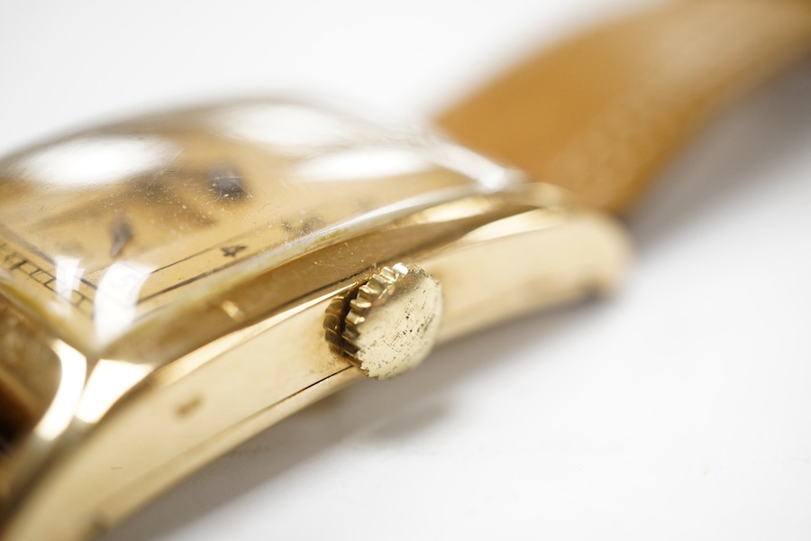 A gentleman's 1930's/1940's 14k gold Zenith manual wind wrist watch, with rectangular Arabic dial and subsidiary seconds, case diameter 25mm, on a later associated leather strap. Condition - fair